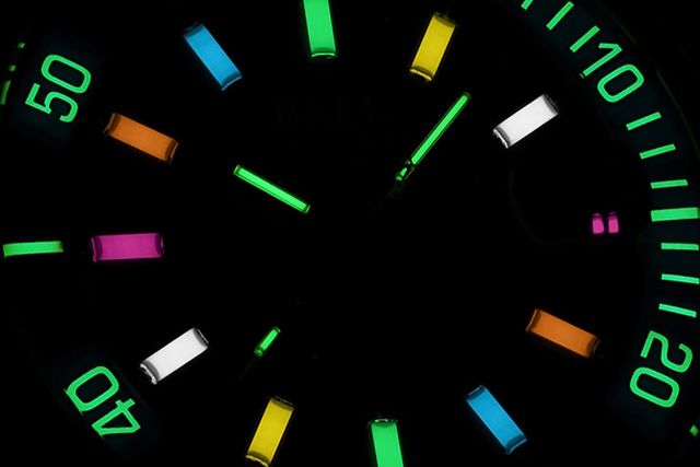 close up of a glowing watch face