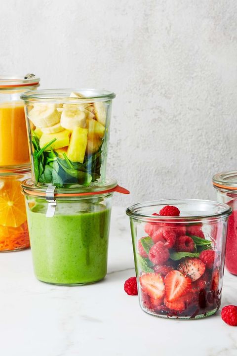 containers of fresh fruit and a green smoothie