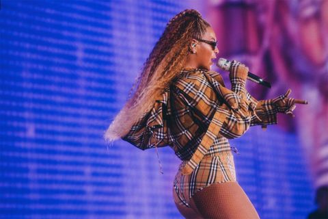 Beyonce wearing Burberry check on stage