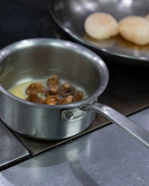 made in stainless clad butter warmer with butter and mushrooms in pot
