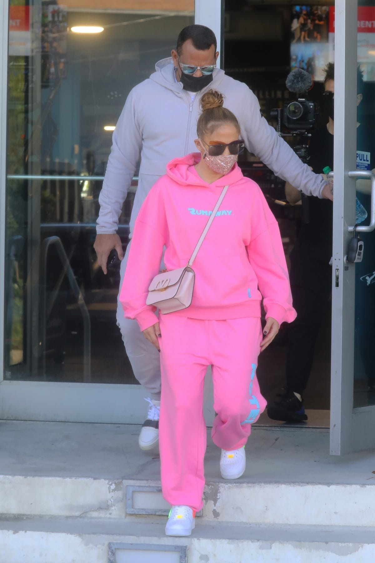 Jennifer Lopez wears a hot-pink sweat suit with A-Rod in Miami