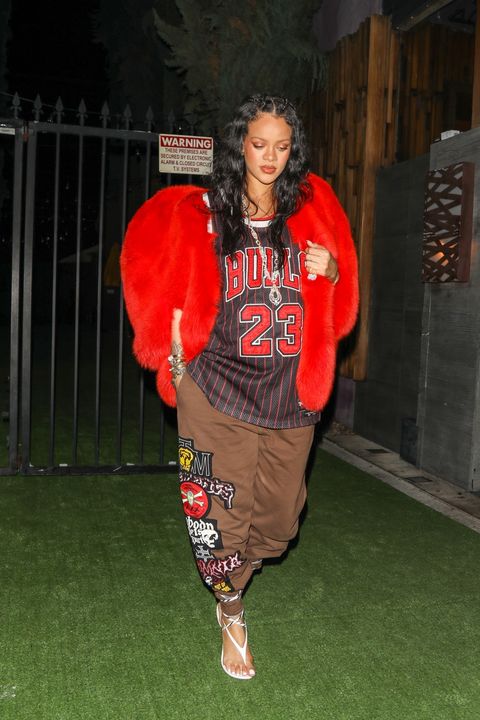 rihanna walks out in bulls jersey and brown pants
