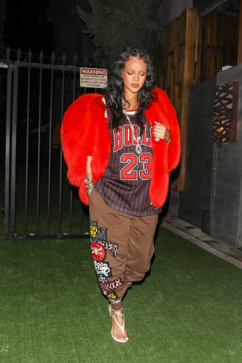 rihanna walks out in bulls jersey and brown pants