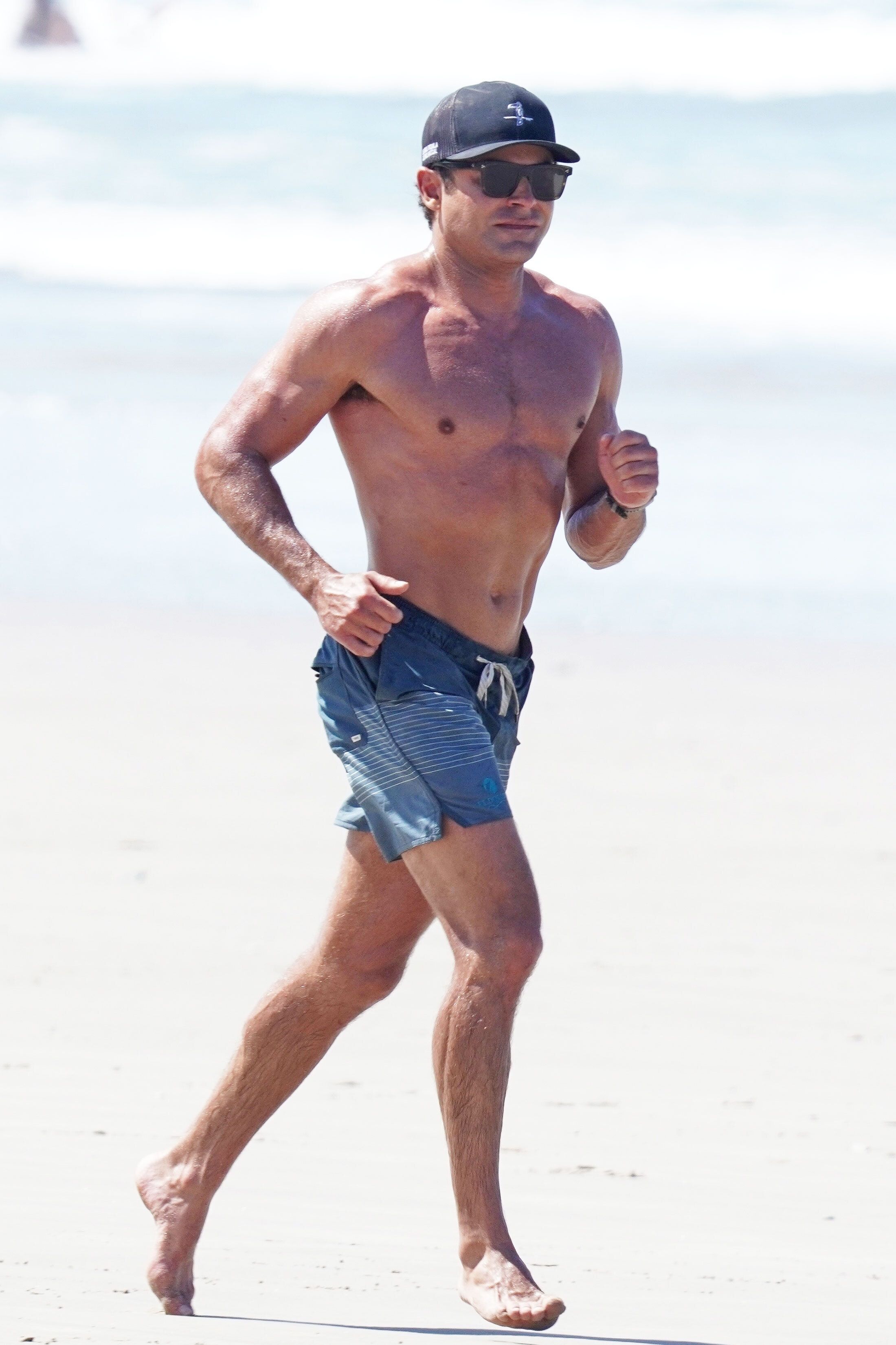 Zac Efron and His Shredded Abs Went for a Shirtless Jog on the Beach