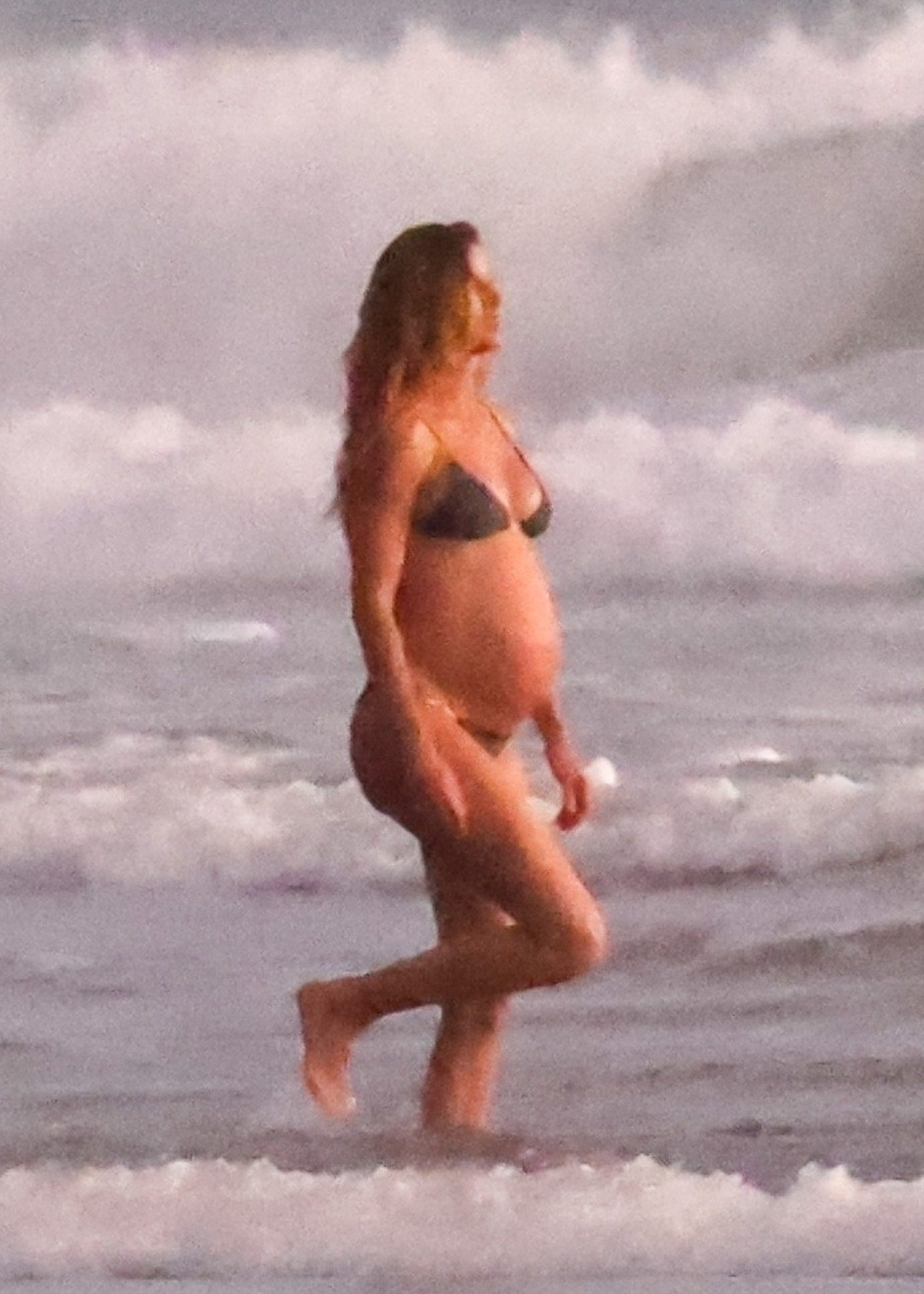 Gisele Bündchen Shows Off Her Baby Bump in a Little Black Bikini