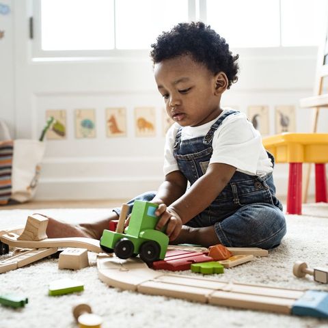 biblical baby names christian names for boys baby boy on floor playing with train