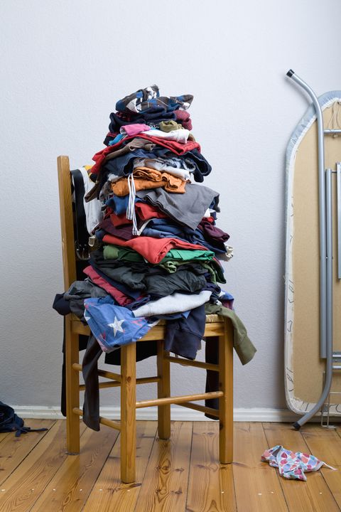 A big untidy stack of clean clothes waiting to be ironed