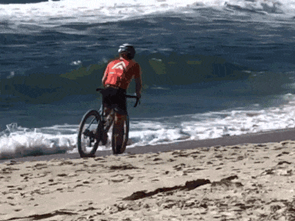 riding a bike on the beach