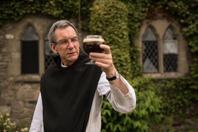 trappist monk father joseph holds a glass of tynt meadow english trappist ale at mount saint bernard abbey near coalville, central england on july 17, 2019   faced with dwindling revenues from dairy farming, the monks at the trappist monastery of mount st bernard abbey in central england decided to swap milk for beer they sold the cows and spent five years setting up a state of the art brewery that can produce around 300,000 bottles a year of tynt meadow, only the 12th beer in the world to receive the centuries old catholic orders coveted seal of approval photo by oli scarff  afp  to go with afp story by james pheby photo by oli scarffafp via getty images