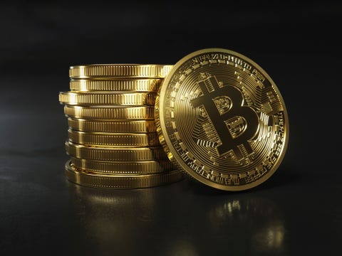 Pile of shiny new gold bitcoins