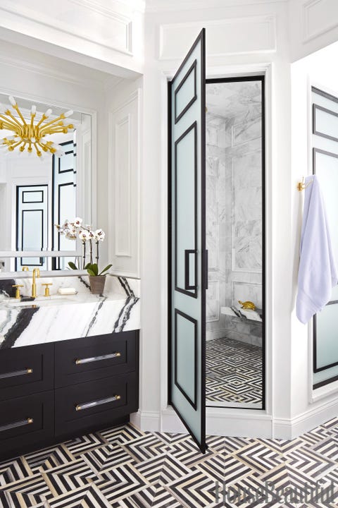 black and white bathroom tiles in a small bathroom