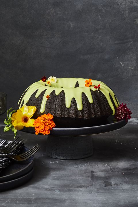 black cocoa cake with dripping green icing on top