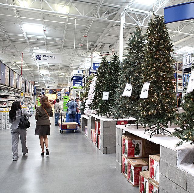 san francisco   november 04  customers at a lowes home improvement store walk by a display of artificial christmas trees on november 4, 2010 in san francisco, california with three weeks to go until thanksgiving, retail stores are beginning to sell holiday merchandise  photo by justin sullivangetty images