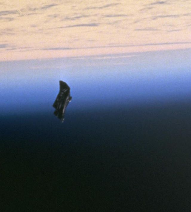 detail of nasa photo id sts088 724 66 taken during space shuttle mission sts 88, described as showing an item of "space debris", an object claimed by conspiracy theorists to be an alien satellite, the black knight