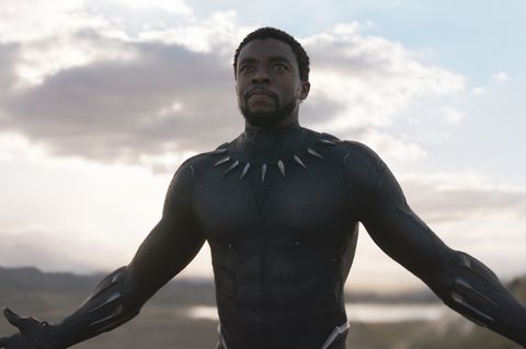 chadwick boseman as t'challa in black panther suit with arms open