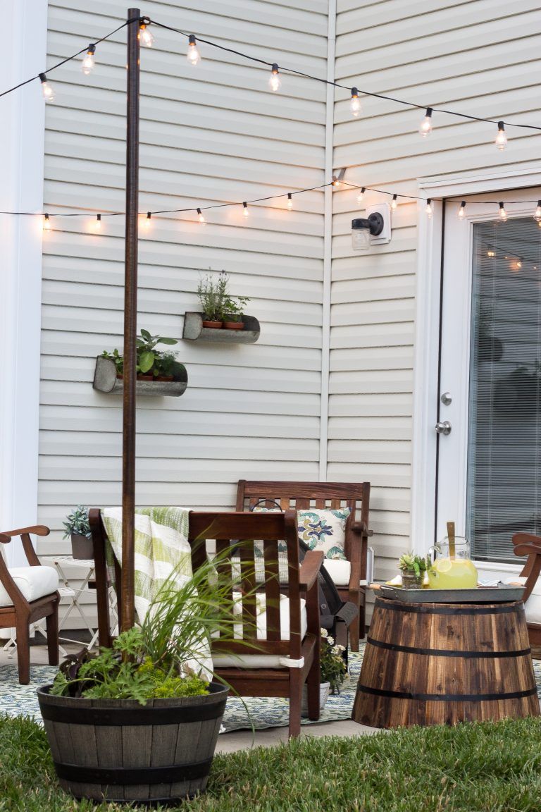 How do you secure outdoor string lights to poles?