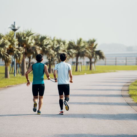 Blind triathlete running and training with his guide