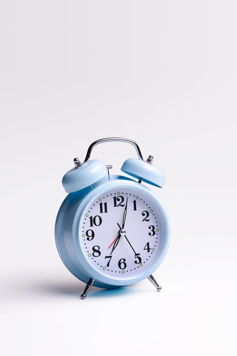 Blue alarm clock on white background