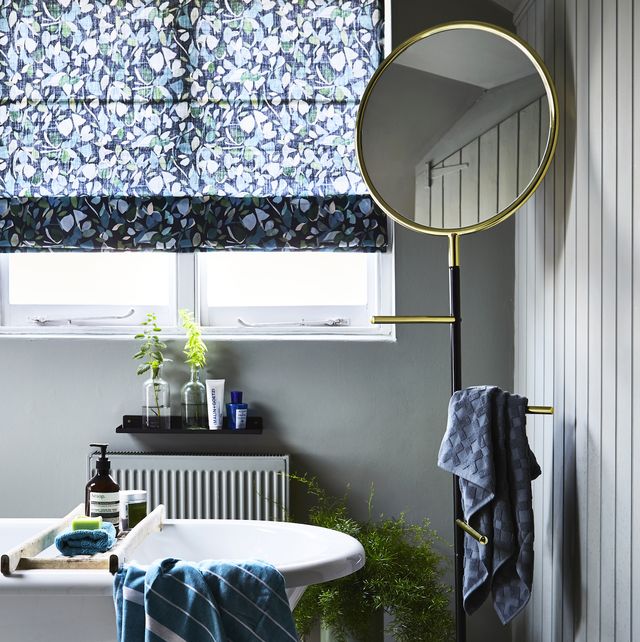 blue themed bathroom with light grey walls