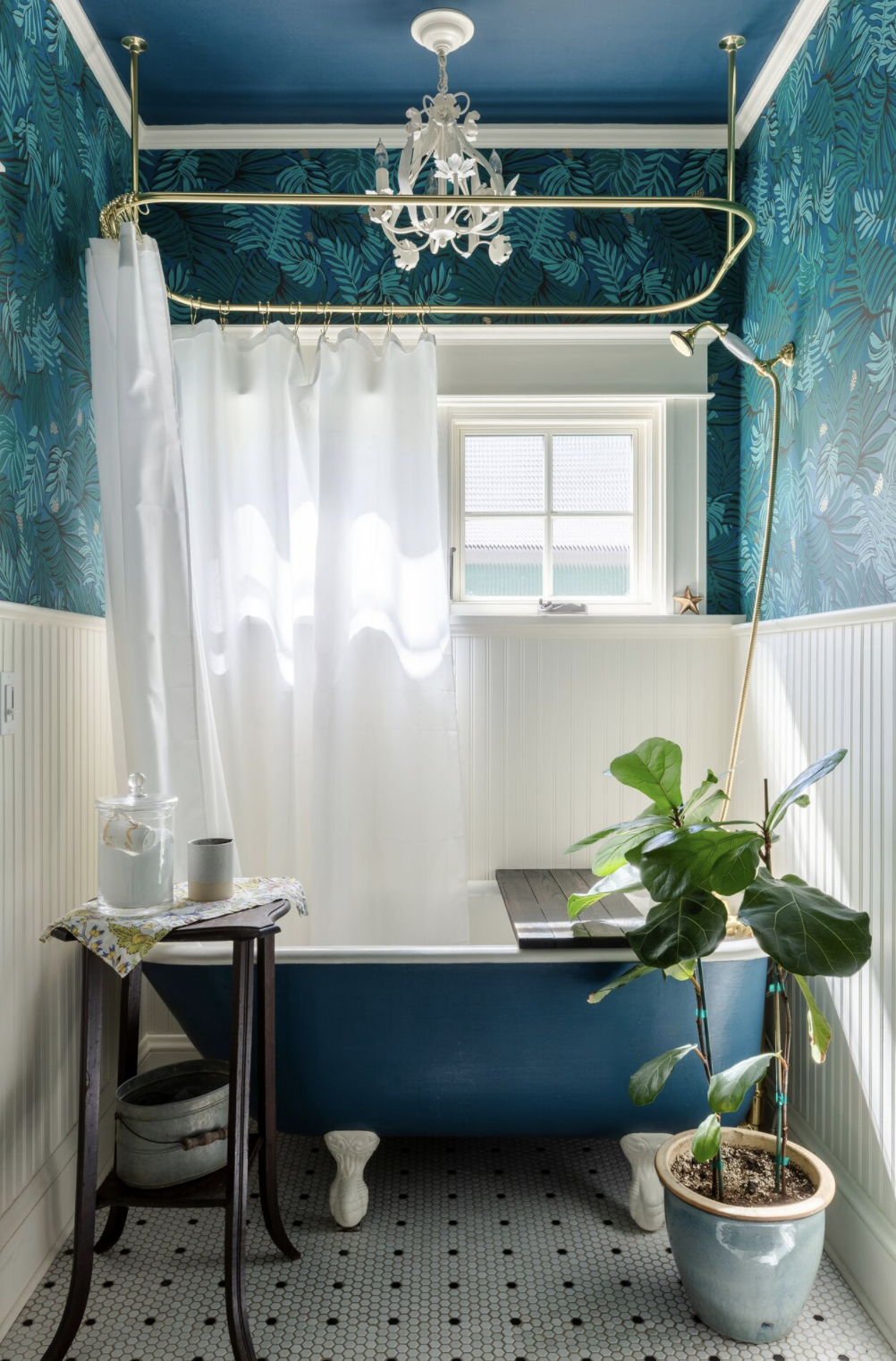 decorating a bathroom with a blue tub