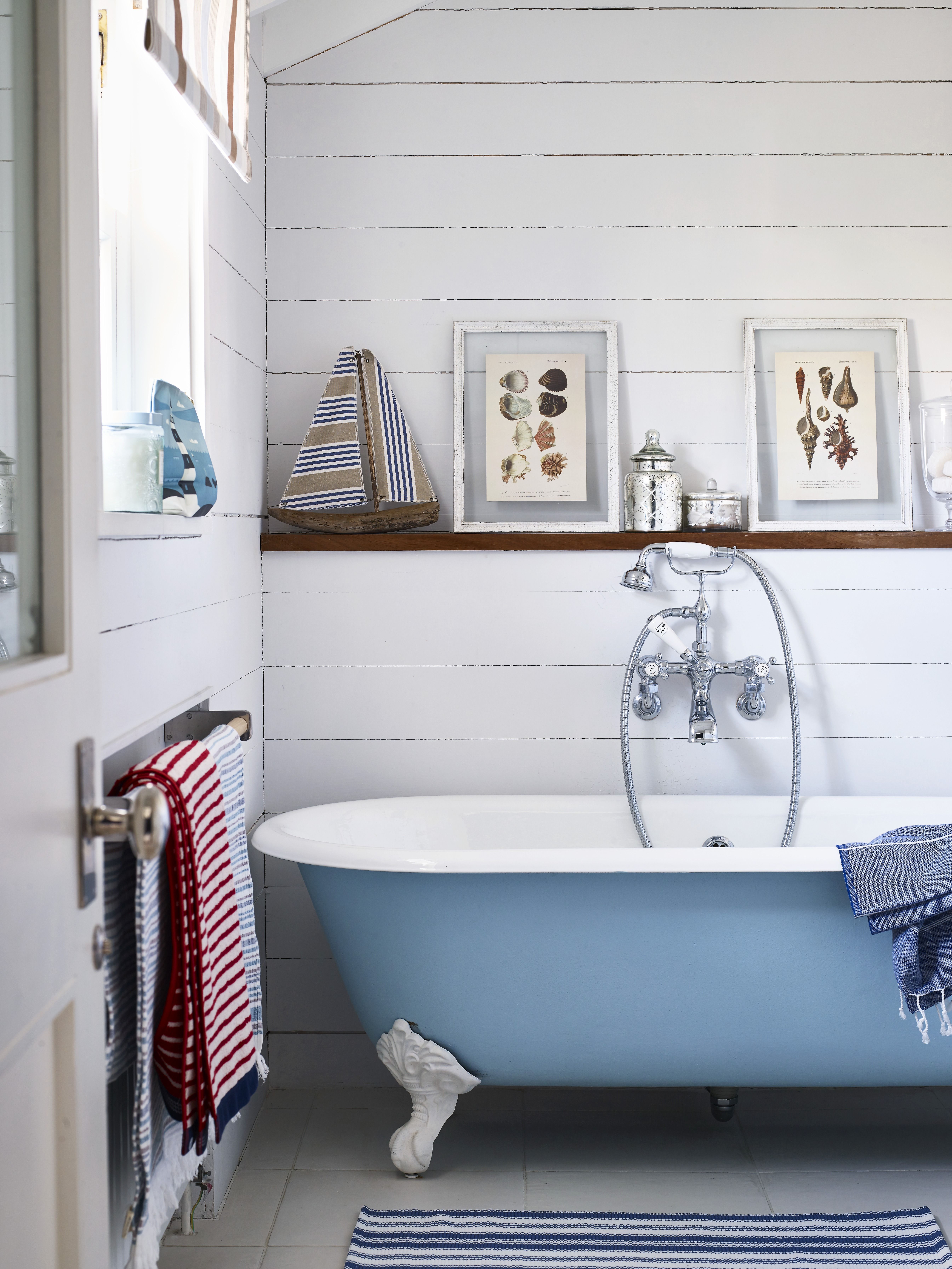 decorating a bathroom with a blue tub