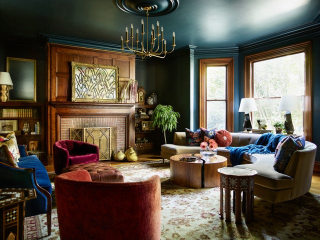 living room
to complement the restored wood accents in this boston colonial revival, local designer cecilia casagrande settled on a deep, rich paint farrow  ball hague blue chandelier arteriors sofa jonathan
adler pillow fabrics from left pierre
frey, house of hackney, romo painting hunt slonem swivel armchairs thayer
coggin coffee table and side table vintage, autrefois antiques ottoman cisco brothers rug ramble market table lamps kelly wearstler for circa lighting