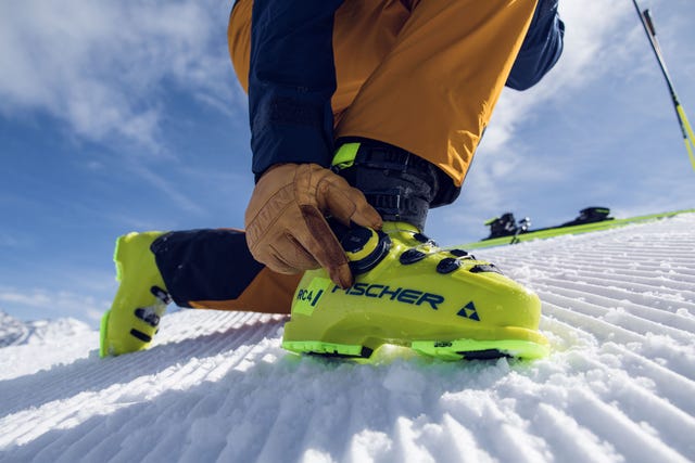 man adjusting boa ski boots