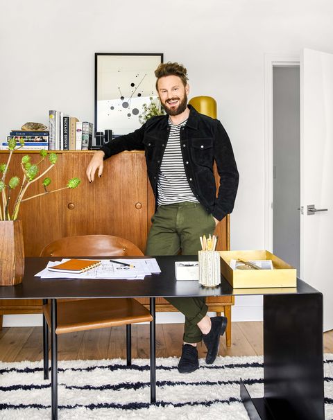 man in black jacket in a home office