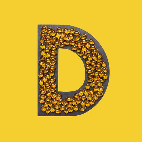 vitamin capsules in the shape of the letter d
