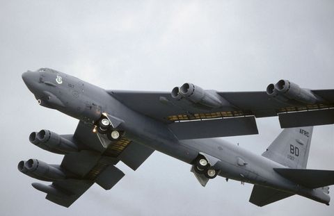 USAF Boeing B-52H Stratofortress taking-off with undercarriage retracting and trailing-edge wing flaps lowered at the 1998 Fairford Royal International Air Tattoo RIAT