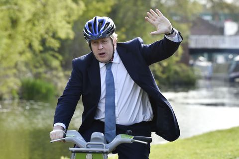 stourbridge, england   may 05 british prime minister boris johnson waves as he rides a bike ride along the towpath of the stourbridge canal in the west midlands during a conservative party local election visit on may 5, 2021 in stourbridge, england political party leaders out campaigning on the final day before voters go to the polls to vote in local elections on thursday, may 6 photo by rui vieira   wpa poolgetty images