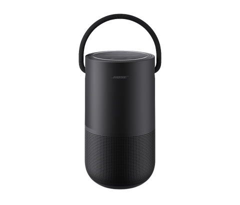 a black portable speaker with a handle on a gray background