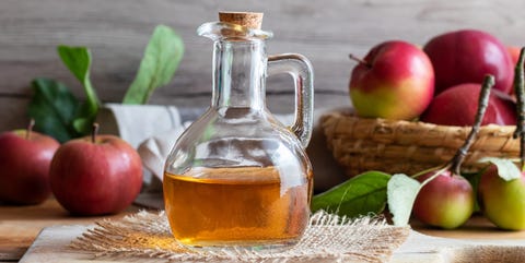 A Bottle Of Apple Cider Vinegar With Fresh Apples