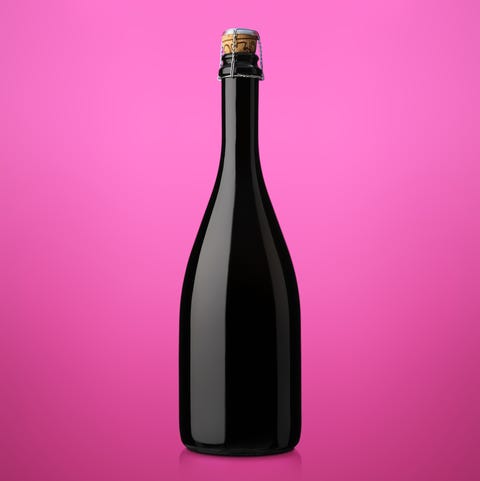 bottle of sparkling wine with cork on a colored background bottle of sparkling wine with cork on a colored background