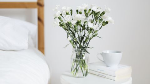 bouquet of white flowers in a bedroom