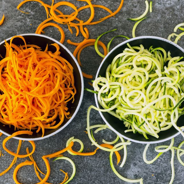 bowl of carrot spaghetti and bowl of zoodles