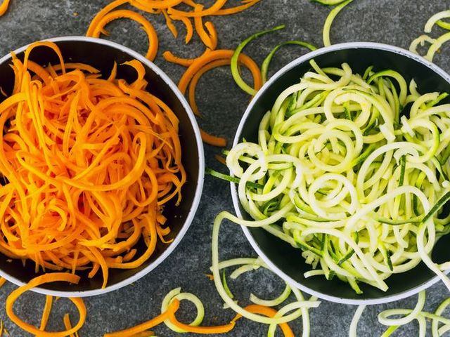 bowl of carrot spaghetti and bowl of zoodles