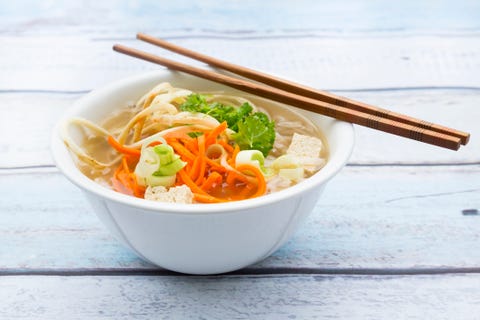 Bowl of miso soup with organic tofu, carrot noodles, parsnip, leek, glass noodles and parsley Bowl of miso soup with organic tofu, carrot noodles, parsnip, leek, glass noodles and parsley
