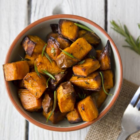 bowl of oven roasted sweet potato with rosemary and thyme
