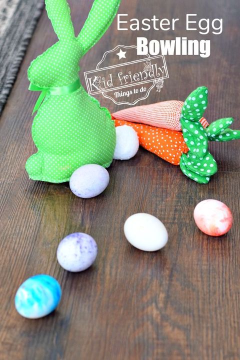 bunny in green fabric with eggs around it