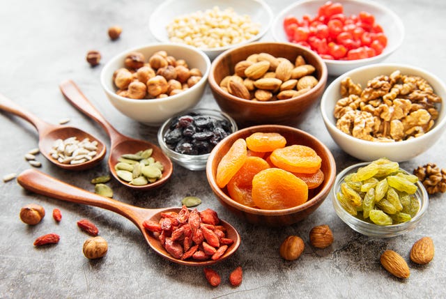 bowls with various dried fruits and nuts