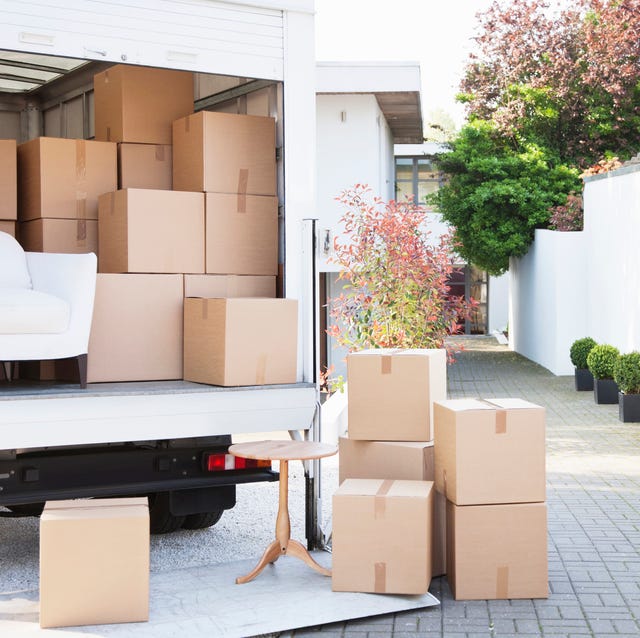 boxes on ground near moving van