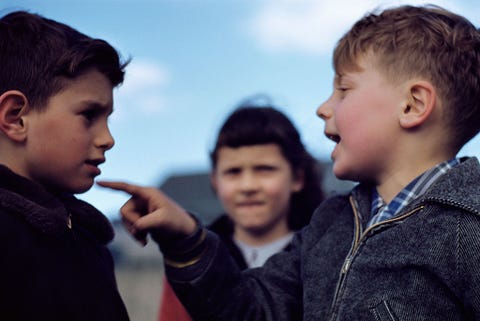 Boy Ridiculing Another boy ridiculing another
