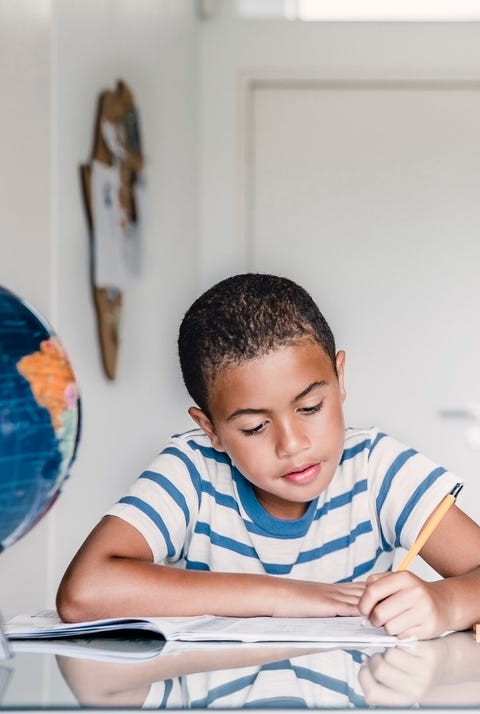 Boy studying at table