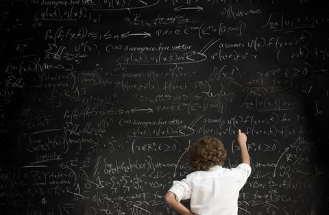 boy with formulae on blackboard