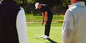 Lewis Hamilton jokes with Tom Brady during a golf session ahead of