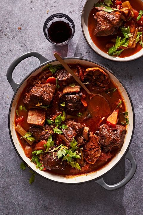 braised short ribs with 40 cloves of garlic in a casserole dish