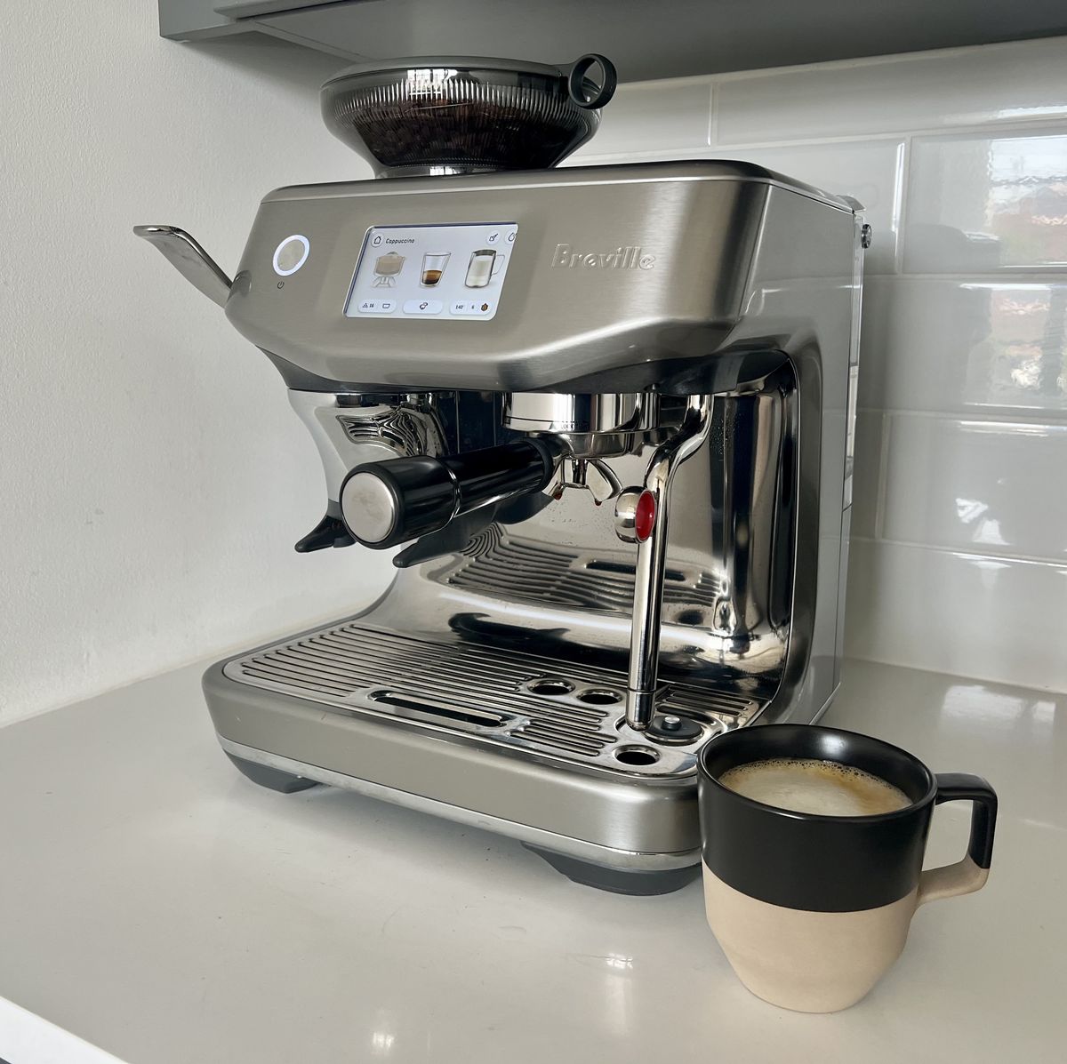 https://hips.hearstapps.com/hmg-prod.s3.amazonaws.com/images/breville-barista-touch-impress-lead-64d15e6aea099.jpg?crop=0.752xw:1.00xh;0.125xw,0&resize=1200:*