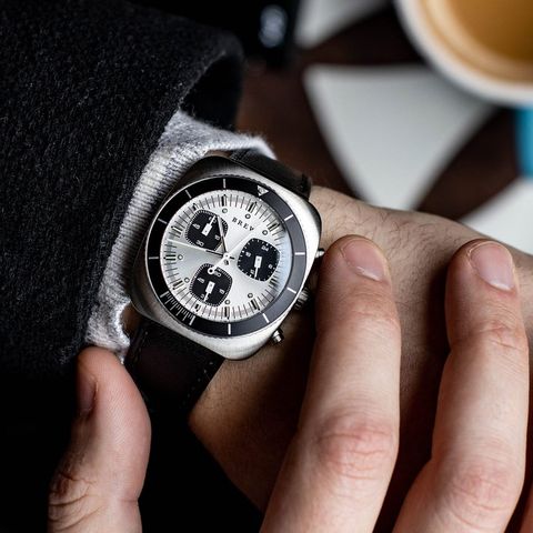 brew chronograph watch on wrist operating pusher