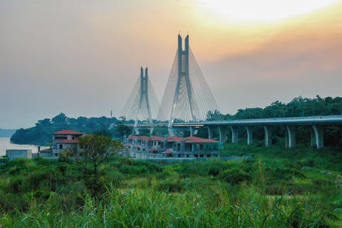 bridge of corniche in haze at sunset in brazzaville